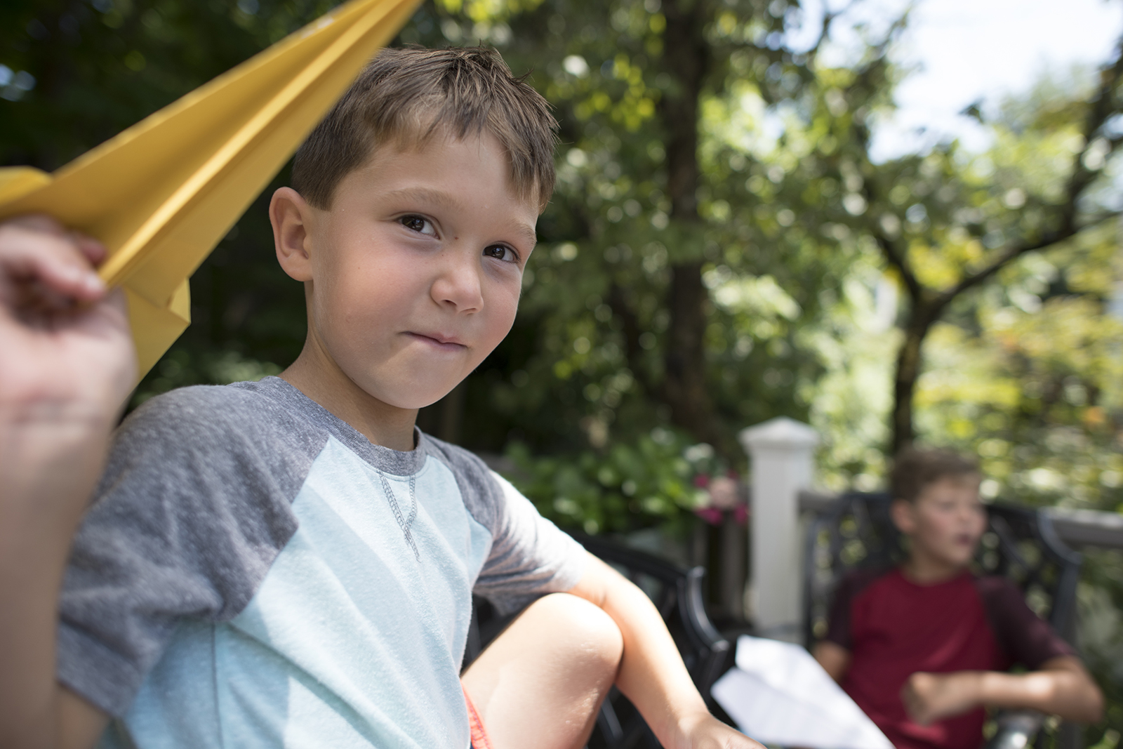 Young boy with paper plane